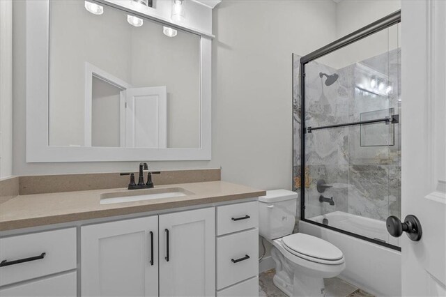 4287 Lake Shore Ct, Basehor, KS 66007 - bathroom featuring vanity, bath / shower combo with glass door, and toilet