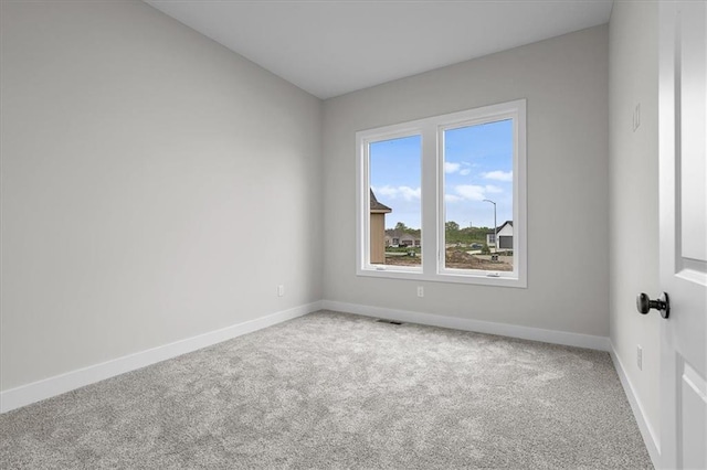 4287 Lake Shore Ct, Basehor, KS 66007 - unfurnished room with baseboards and carpet