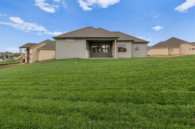 4287 Lake Shore Ct, Basehor, KS 66007 - rear view of property featuring a yard and roof with shingles
