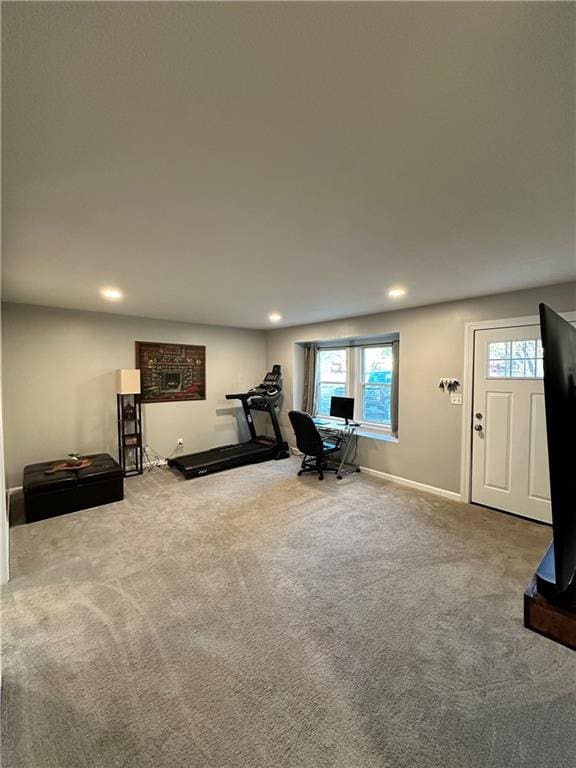 exercise area featuring carpet flooring and plenty of natural light