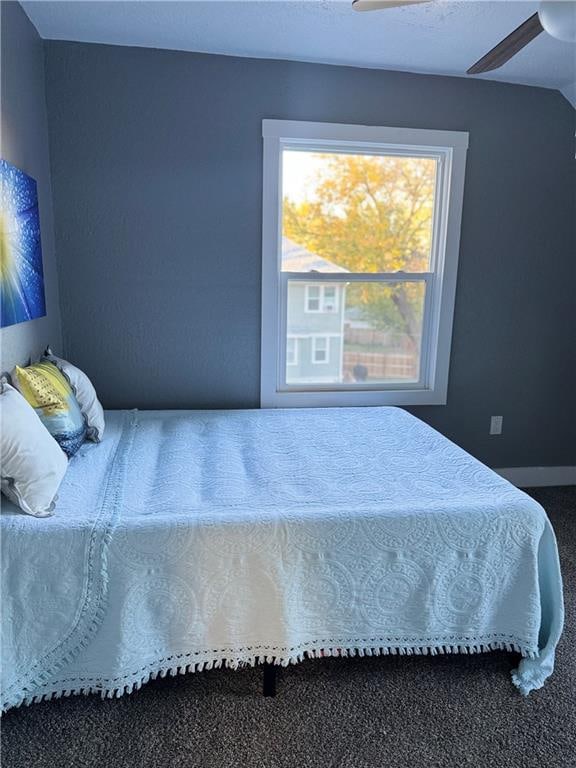 carpeted bedroom featuring ceiling fan