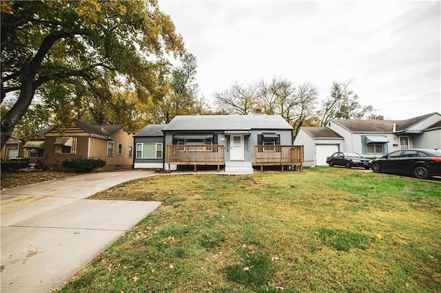 ranch-style house featuring a garage and a front lawn