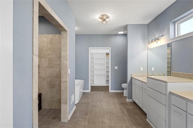 full bathroom featuring vanity, independent shower and bath, and toilet