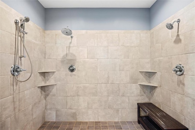 bathroom with a tile shower