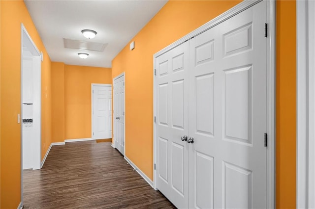 hall with dark hardwood / wood-style floors