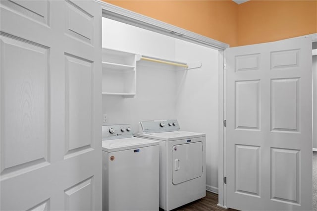 laundry area featuring dark hardwood / wood-style floors and independent washer and dryer