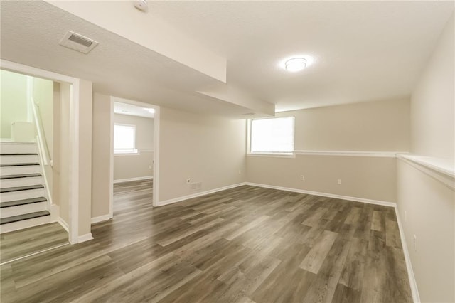 basement featuring dark wood-type flooring