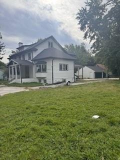 4203 E 68th St, Kansas City, MO 64132 - view of home's exterior with a yard