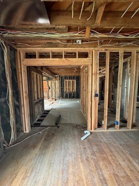 4203 E 68th St, Kansas City, MO 64132 - misc room with wood finished floors