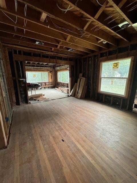 4203 E 68th St, Kansas City, MO 64132 - miscellaneous room with healthy amount of natural light and hardwood / wood-style floors