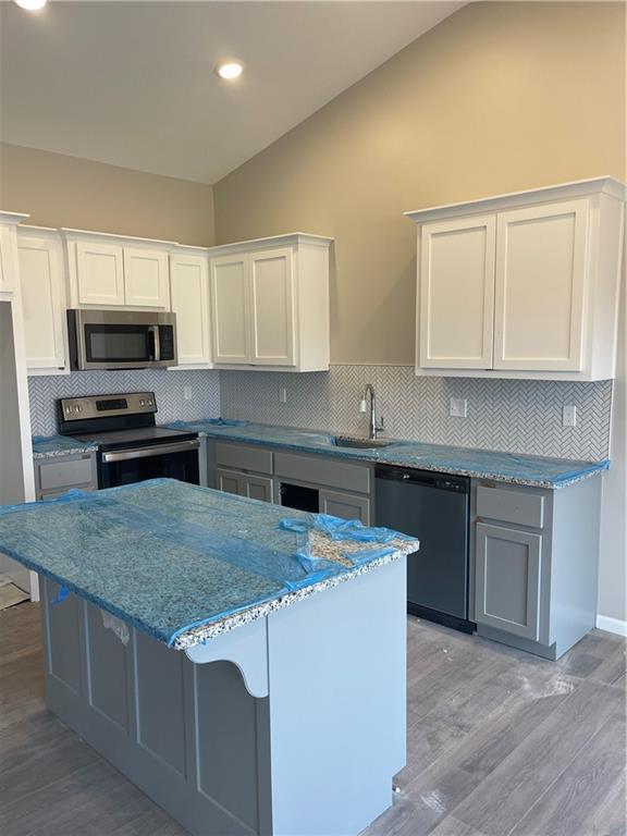 kitchen featuring white cabinetry, appliances with stainless steel finishes, and sink