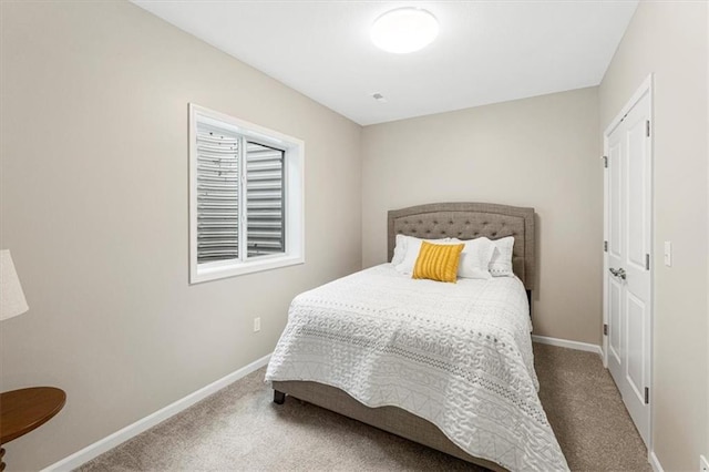 bedroom with baseboards and carpet floors