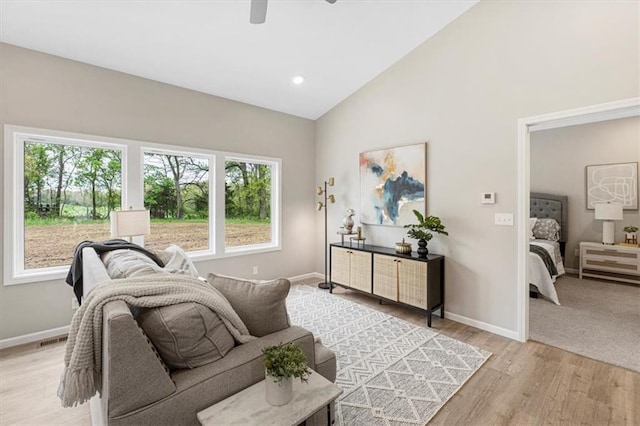 800 Highland Dr, Edwardsville, KS 66111 - living room featuring ceiling fan, light wood-style floors, high vaulted ceiling, and recessed lighting