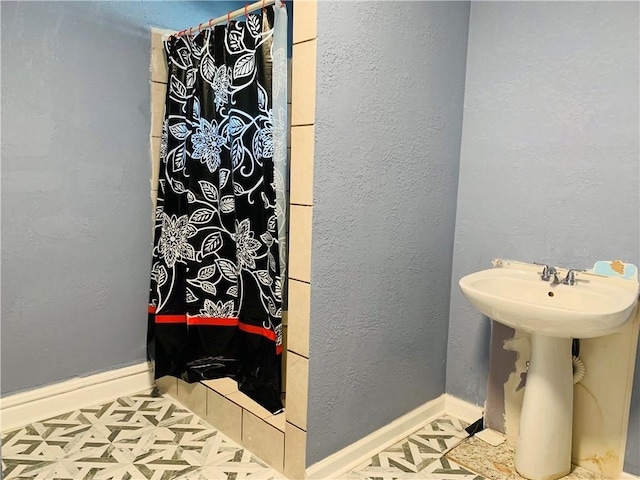 bathroom with tile patterned flooring