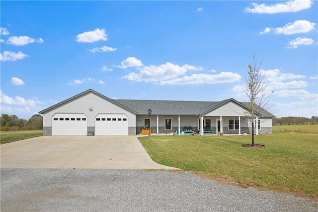 ranch-style home featuring a garage, a front lawn, and a porch