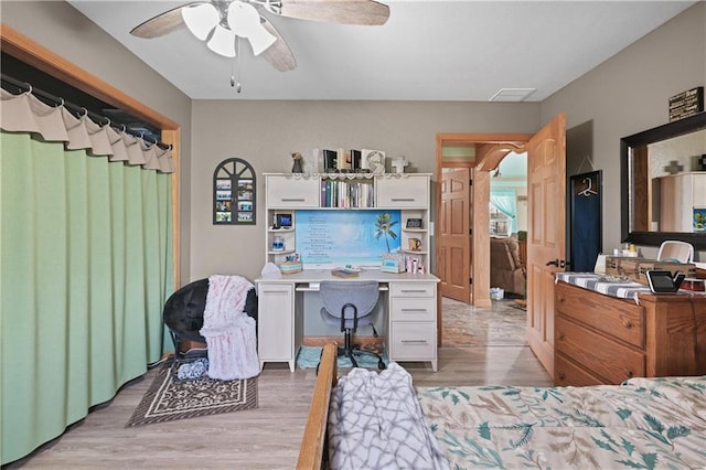 bedroom with light wood-type flooring and ceiling fan