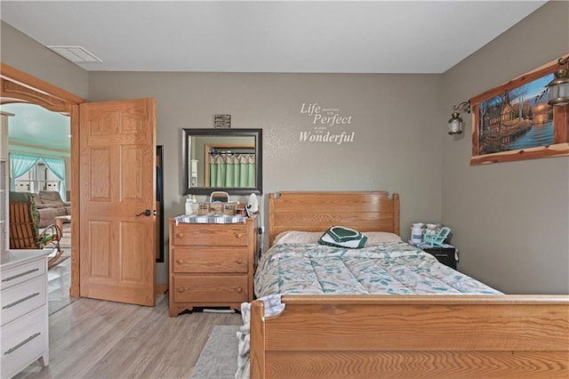 bedroom with light hardwood / wood-style flooring