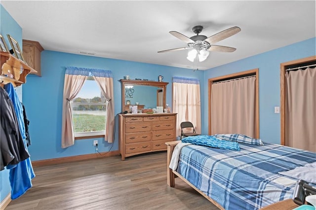 bedroom featuring hardwood / wood-style floors and ceiling fan