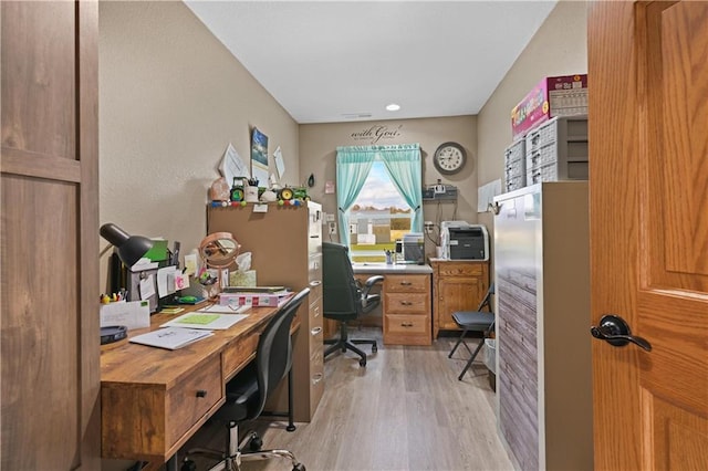 office space with light wood-type flooring