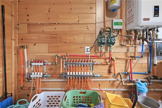 utility room featuring water heater