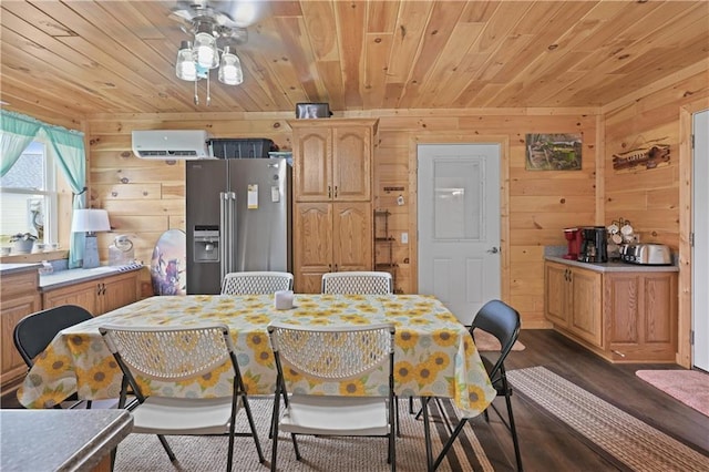 dining area with dark hardwood / wood-style flooring, wood walls, an AC wall unit, and ceiling fan