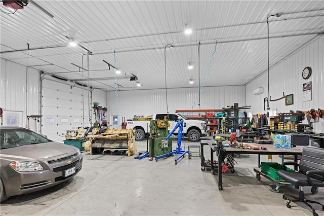 garage featuring a workshop area and a garage door opener