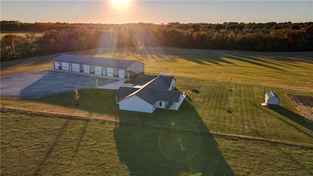 aerial view at dusk featuring a rural view