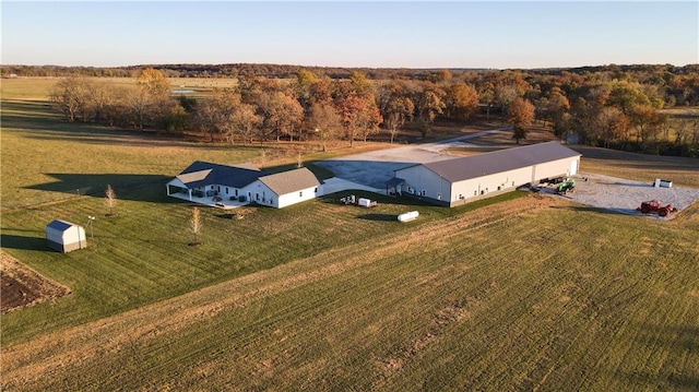 birds eye view of property featuring a rural view