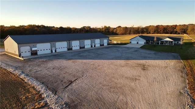 exterior space with an outbuilding and a garage