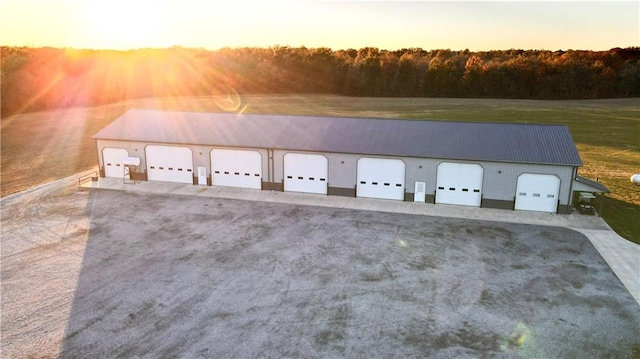 view of garage at dusk