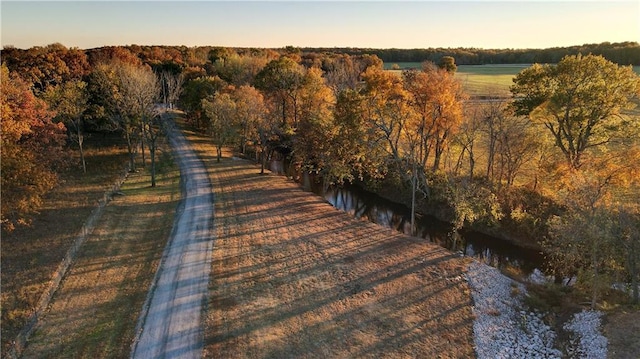 aerial view at dusk featuring a rural view