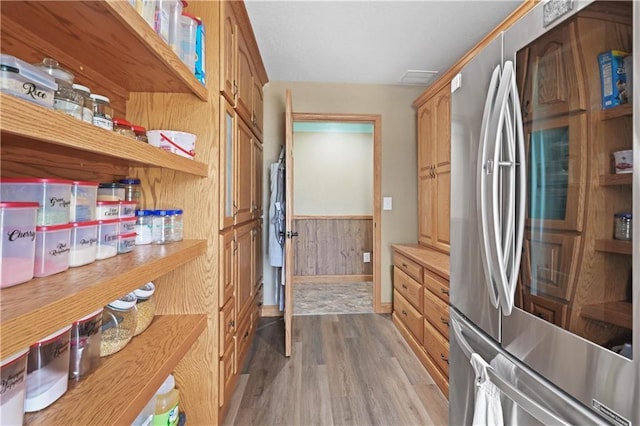 1185 Route E, Lockwood, MO 65682 - interior space featuring freestanding refrigerator, open shelves, wood finished floors, baseboards, and light countertops