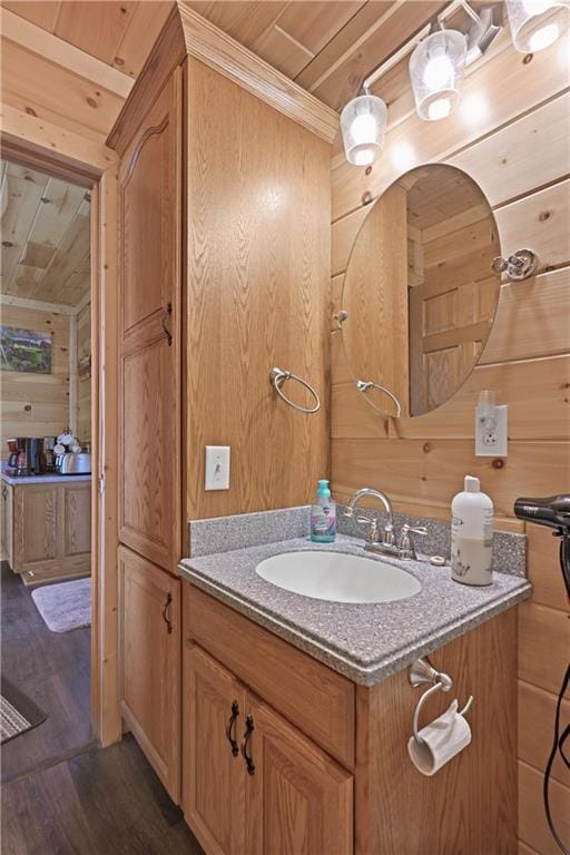 1185 Route E, Lockwood, MO 65682 - bathroom with wood ceiling, vanity, wood walls, and wood finished floors
