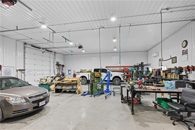 1185 Route E, Lockwood, MO 65682 - garage with a workshop area and a garage door opener