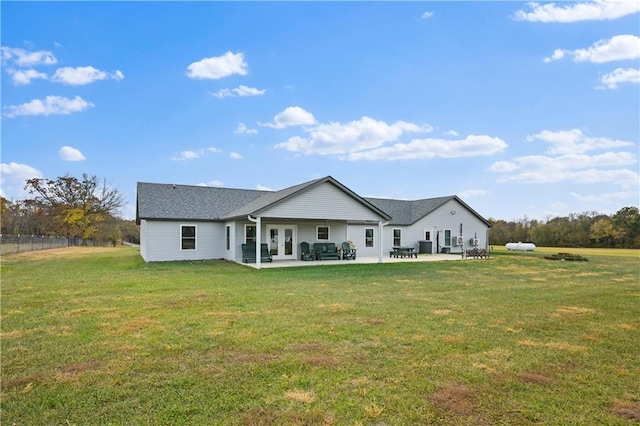 1185 Route E, Lockwood, MO 65682 - rear view of property featuring a lawn, a patio, and french doors