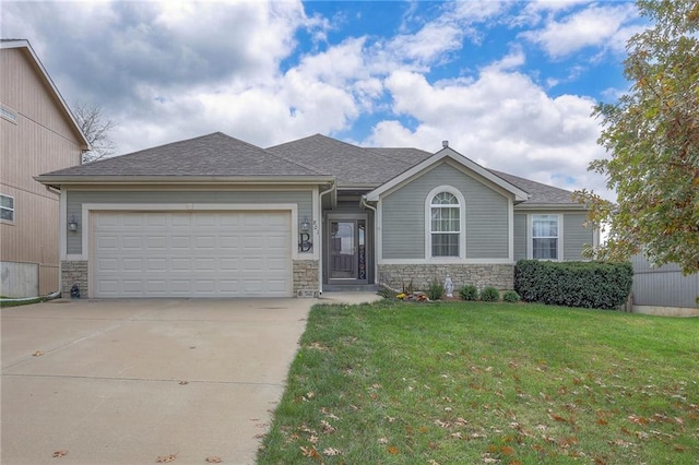 view of front of home featuring a garage and a front yard