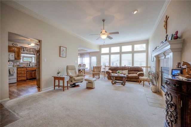 living room with a fireplace, wood-type flooring, ceiling fan, and ornamental molding