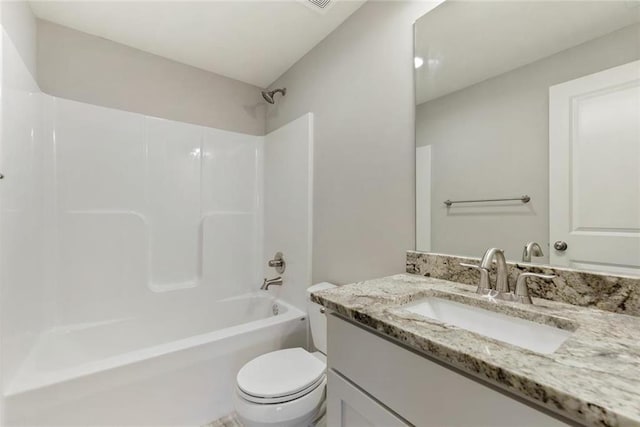 full bathroom with washtub / shower combination, vanity, and toilet