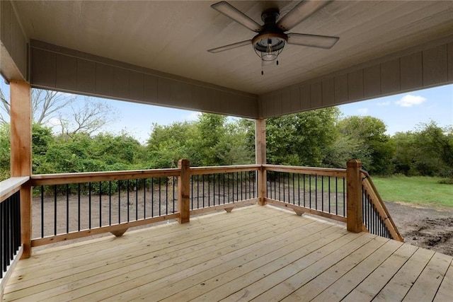 wooden terrace featuring ceiling fan