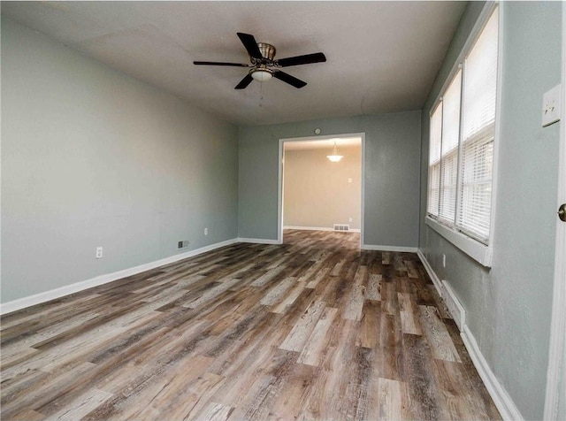 unfurnished room with hardwood / wood-style floors and ceiling fan