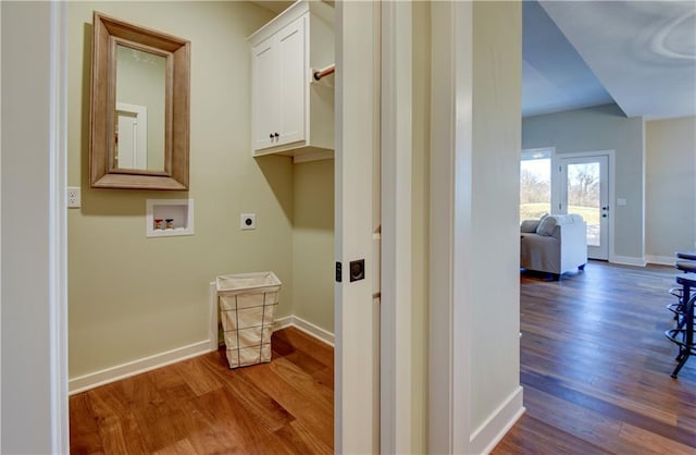 washroom with cabinets, washer hookup, hardwood / wood-style floors, and electric dryer hookup