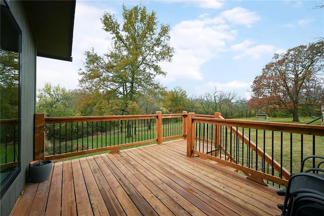 wooden deck with a lawn