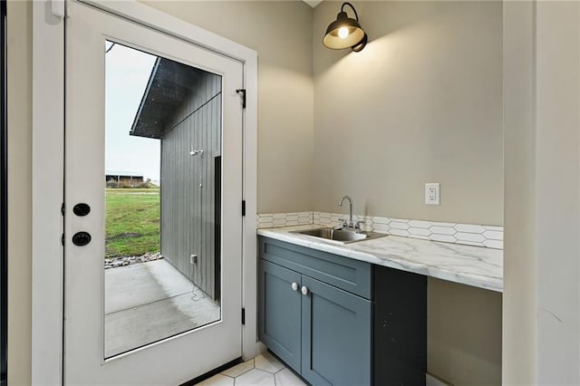 bathroom with plenty of natural light, vanity, and tile patterned floors