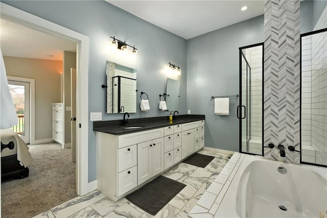 bathroom featuring shower with separate bathtub and vanity