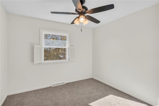 empty room featuring ceiling fan and carpet floors