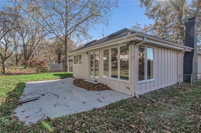 view of side of property featuring a patio