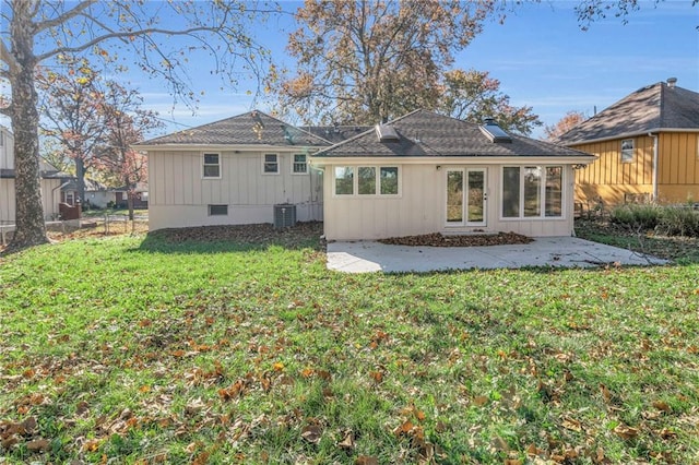 back of property featuring a yard, a patio, and central AC unit