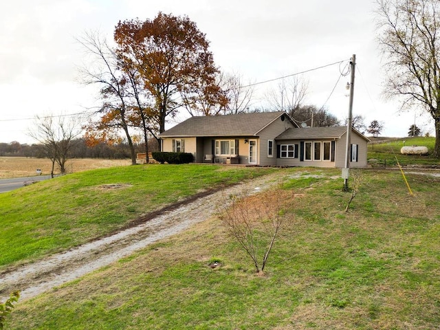 ranch-style home with a front yard