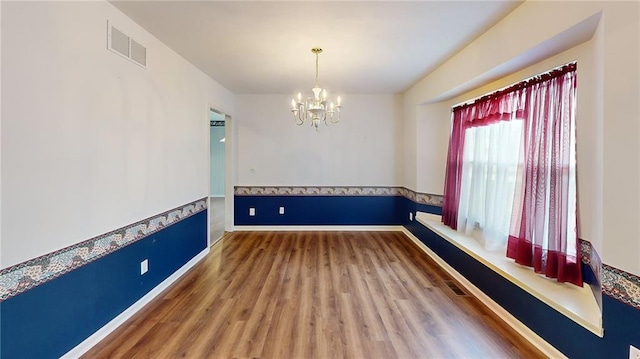 interior space featuring a chandelier and hardwood / wood-style floors