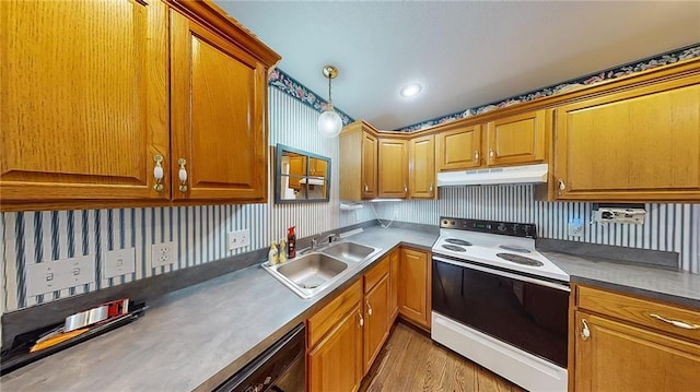 kitchen with dishwasher, sink, hanging light fixtures, white range with electric stovetop, and light hardwood / wood-style floors